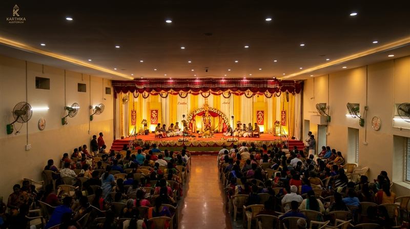 Traditional ceremony on stage before a packed hall