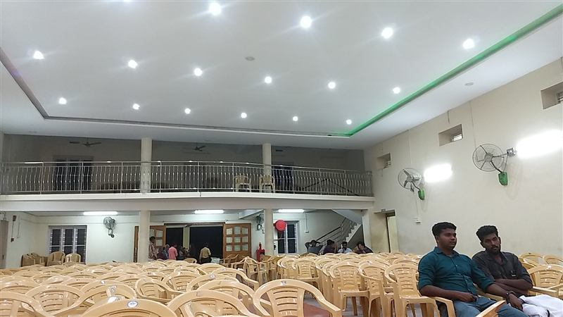 Wedding in progress with guests filling the hall