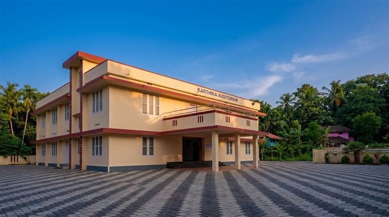 Karthika Auditorium exterior on a clear blue-sky day