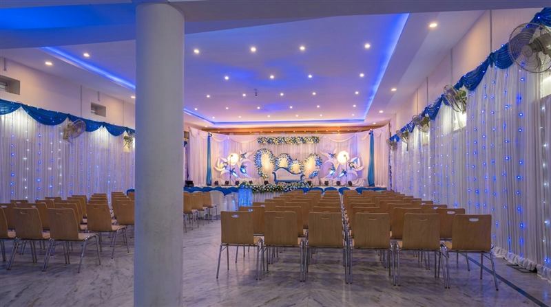 Hall in blue theme with modern chairs and heart backdrop