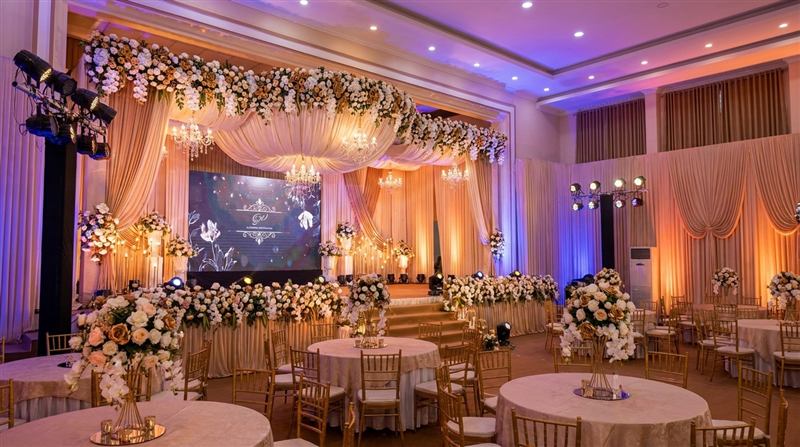 Banquet layout with round tables and floral centrepieces