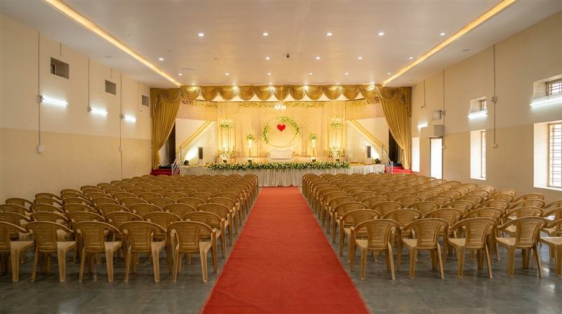 Main hall dressed in gold with a red carpet aisle