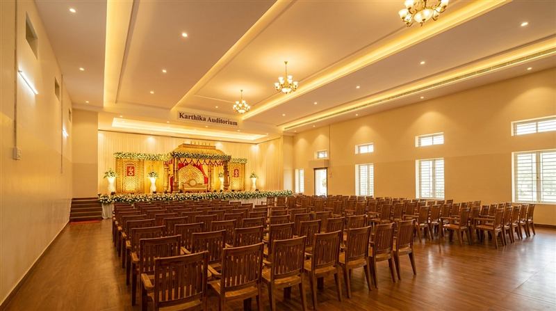 Grand wedding mandap with chandeliers in the main hall